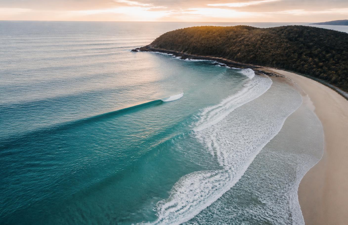 Aerial view of an Australian point break at dawn